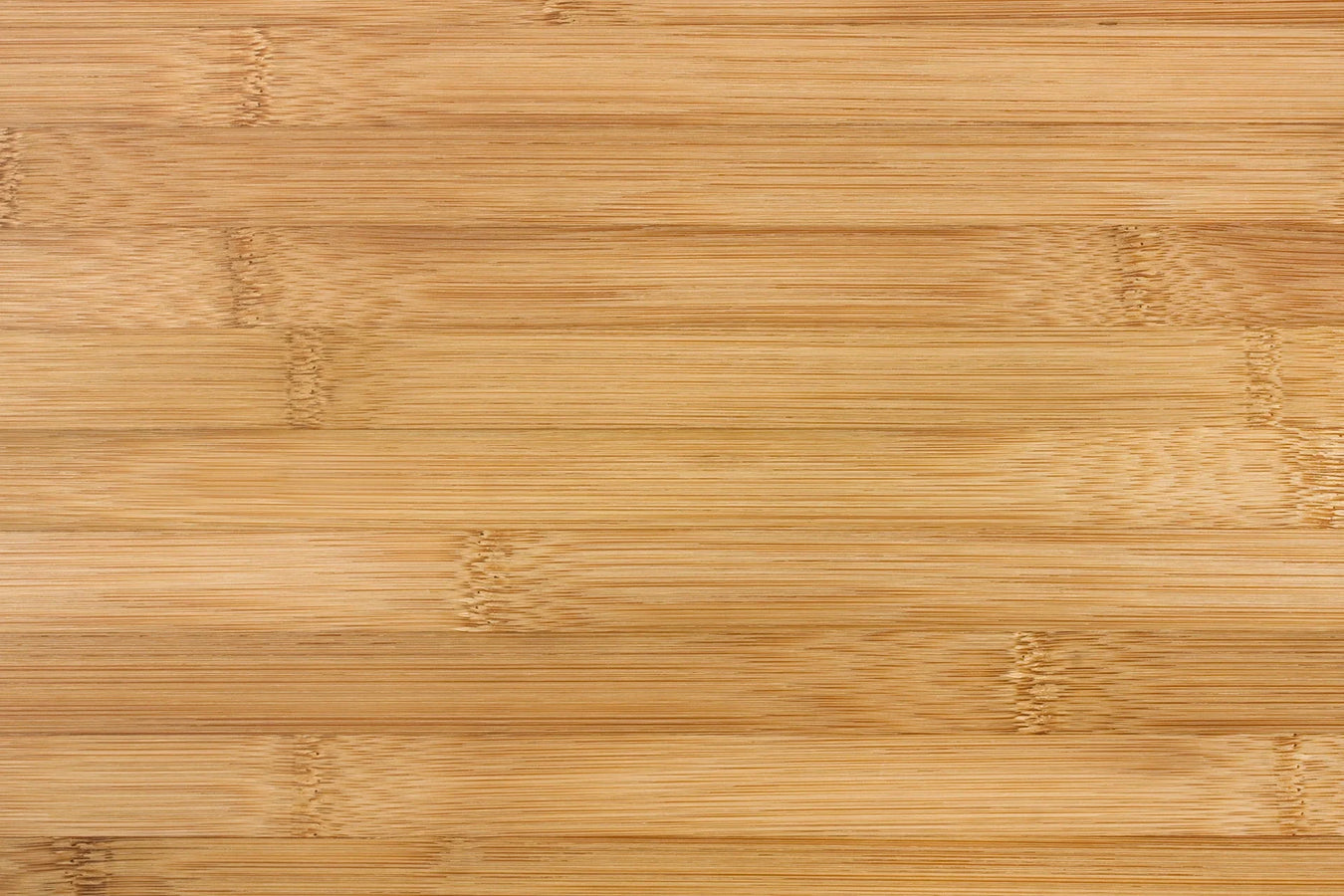 Close-up of natural horizontal bamboo flooring with smooth finish and uniform grain pattern.