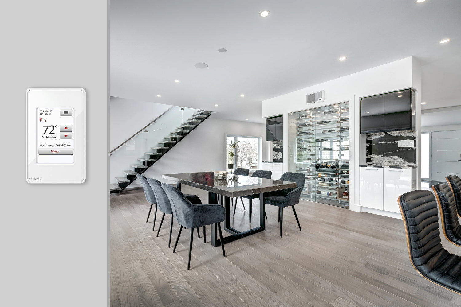 Modern dining room with heated laminate flooring and electric radiant heating for cost-effective luxury warmth and quick response heating.