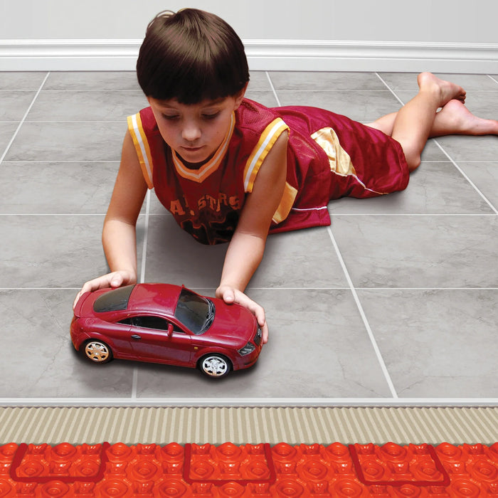 Boy playing on heated tile floor