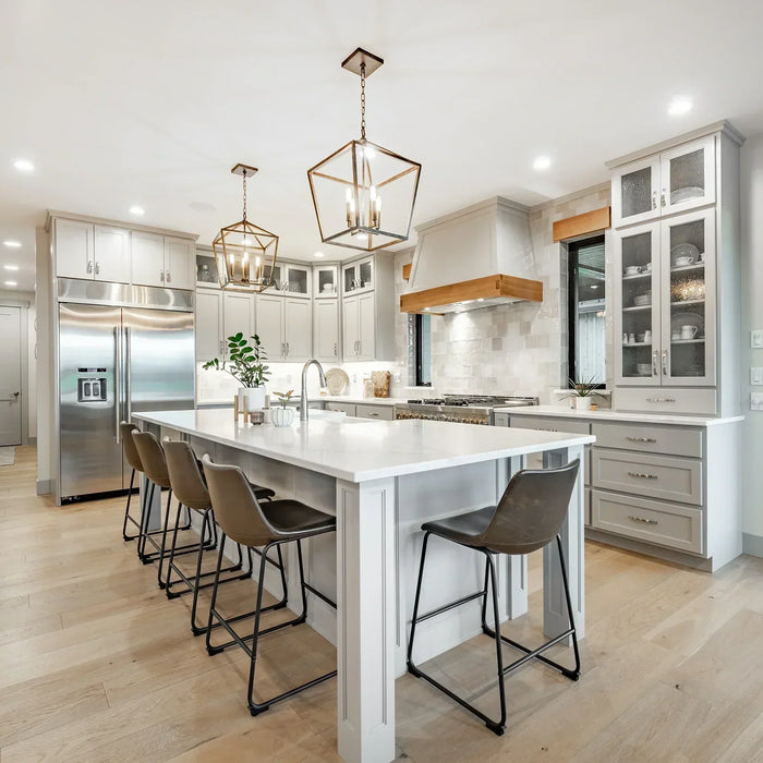 Modern kitchen with island seating and pendant lighting featuring a heated kitchen floor and underfloor heating kitchen system.